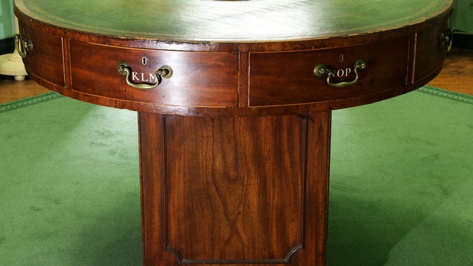 Rent table in the Octagon on a green carpet at A la Ronde, Devon